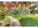 Lush community grounds with mature trees, manicured lawns, and a winding pathway at 2633 S Durango Dr # 201, Las Vegas, NV 89117
