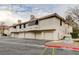 Exterior view of townhome with multiple garage doors and private balcony at 2633 S Durango Dr # 201, Las Vegas, NV 89117