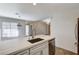 Kitchen sink and countertop details, with a view to the dining and living areas at 2633 S Durango Dr # 201, Las Vegas, NV 89117