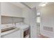 Convenient laundry room equipped with a washer and dryer at 2633 S Durango Dr # 201, Las Vegas, NV 89117