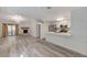 Open-concept living room showcasing a fireplace, modern light fixtures, and seamless flow to the kitchen at 2633 S Durango Dr # 201, Las Vegas, NV 89117