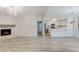 Bright open-concept living space with fireplace, modern flooring, and seamless flow to the updated kitchen at 2633 S Durango Dr # 201, Las Vegas, NV 89117