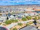 Aerial view showcases the vibrant community with lush landscaping, sidewalks, and nearby desert mountain backdrop at 2637 Via Monet, Henderson, NV 89044