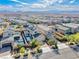 Aerial view of a modern neighborhood with community pools and mountain views at 2637 Via Monet, Henderson, NV 89044