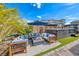 Outdoor oasis featuring a hot tub, fire pit, and comfortable seating, perfect for relaxation and entertaining at 2637 Via Monet, Henderson, NV 89044