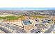 An aerial view showcasing baseball fields, tennis courts, parking and a vibrant community setting at 2637 Via Monet, Henderson, NV 89044