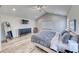 Neutral bedroom boasts vaulted ceilings, plush bedding, and modern fixtures at 2637 Via Monet, Henderson, NV 89044