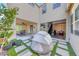 Private courtyard featuring a unique lounging space surrounded by lush greenery and elegant landscaping at 2637 Via Monet, Henderson, NV 89044
