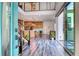 Inviting foyer with staircase and floor-to-ceiling sliding glass doors, creating a bright, welcoming entrance at 2637 Via Monet, Henderson, NV 89044