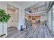 Spacious foyer with staircase leading to an open-concept kitchen and living area with natural light at 2637 Via Monet, Henderson, NV 89044