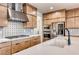 Well-equipped kitchen boasting stainless steel appliances, ample counter space, and modern fixtures at 2637 Via Monet, Henderson, NV 89044