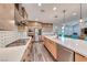 Modern kitchen featuring stainless steel appliances and direct view into living room and dining area at 2637 Via Monet, Henderson, NV 89044
