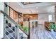 Open floor plan with modern kitchen featuring stainless steel appliances and a breakfast bar with seating at 2637 Via Monet, Henderson, NV 89044