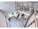 Open loft area features workout equipment, a view of the living space below, and natural light at 2637 Via Monet, Henderson, NV 89044