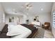 Spacious main bedroom with neutral decor, vaulted ceiling, and access to ensuite bathroom at 2637 Via Monet, Henderson, NV 89044