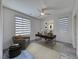 Bright office space featuring neutral decor, stylish window coverings, and a contemporary ceiling fan at 2637 Via Monet, Henderson, NV 89044