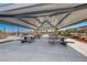 A shaded picnic area with modern picnic tables and stunning desert landscape views at 2637 Via Monet, Henderson, NV 89044