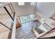 View from the top of a modern staircase overlooking a spacious living area and an inner courtyard at 2637 Via Monet, Henderson, NV 89044