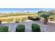Landscaped backyard with a variety of desert plants and green space at 2702 Grand Forks Rd, Henderson, NV 89052