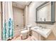 Bright bathroom featuring a shower-tub combo with decorative blue and green floral shower curtain at 2702 Grand Forks Rd, Henderson, NV 89052