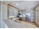 Well-appointed kitchen with stainless steel appliances, ample counter space, light cabinets, and tile flooring at 2702 Grand Forks Rd, Henderson, NV 89052