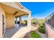 Covered patio with stucco columns overlooking desert landscaping at 2702 Grand Forks Rd, Henderson, NV 89052