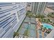 Aerial view of community amenities including tennis courts and a swimming pool at 2877 Paradise Rd # 1804, Las Vegas, NV 89109