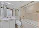 Bright bathroom featuring marble countertop, ample mirror, and glass-enclosed tub at 2877 Paradise Rd # 1804, Las Vegas, NV 89109