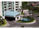 A building entrance featuring a circular driveway, palm trees, and a fountain at 2877 Paradise Rd # 1804, Las Vegas, NV 89109