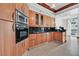 Well-equipped kitchen featuring stainless steel appliances and wood cabinetry at 2877 Paradise Rd # 1804, Las Vegas, NV 89109