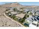 Luxurious community with elegant homes, verdant landscaping and a private pool surrounded by lush trees at 2927 The Peaks Ln, Las Vegas, NV 89138