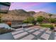 Stunning backyard with pool, jacuzzi, putting green, and mountain views at 2927 The Peaks Ln, Las Vegas, NV 89138