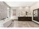 Elegant bathroom featuring freestanding tub, dark wood cabinets, and designer tile at 2927 The Peaks Ln, Las Vegas, NV 89138
