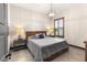 Cozy bedroom with a modern light fixture, neutral tones, and stylish accents at 2927 The Peaks Ln, Las Vegas, NV 89138