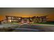 Gorgeous clubhouse with sleek architectural design, abundant natural light, and professionally landscaped grounds at 2927 The Peaks Ln, Las Vegas, NV 89138