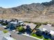 Charming home with impeccable landscaping surrounded by lush green lawns and mountain vistas at 2927 The Peaks Ln, Las Vegas, NV 89138