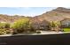 Charming home featuring a three-car garage and desert landscaping at 2927 The Peaks Ln, Las Vegas, NV 89138
