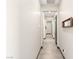 Interior hallway featuring tile floors and neutral paint at 2927 The Peaks Ln, Las Vegas, NV 89138