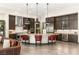 Gourmet kitchen with stainless steel appliances, granite countertops, and a large center island at 2927 The Peaks Ln, Las Vegas, NV 89138