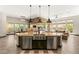 Open-concept kitchen with modern appliances, a spacious island, and seamless living space access at 2927 The Peaks Ln, Las Vegas, NV 89138