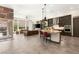 Open concept living space featuring a large island, stainless steel appliances and comfortable seating at 2927 The Peaks Ln, Las Vegas, NV 89138