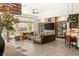 Spacious living room features large windows, comfortable leather seating, and modern decor at 2927 The Peaks Ln, Las Vegas, NV 89138