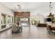 Spacious living room featuring a wood wall, dining area, and modern decor at 2927 The Peaks Ln, Las Vegas, NV 89138