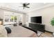 Spacious main bedroom featuring a seating area with backyard view and television at 2927 The Peaks Ln, Las Vegas, NV 89138