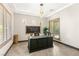 Home office with natural light, modern desk, and stylish decor at 2927 The Peaks Ln, Las Vegas, NV 89138