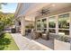 Outdoor patio featuring a dining set, barbecue, and views of the backyard at 2927 The Peaks Ln, Las Vegas, NV 89138