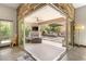 Relaxing outdoor patio area with a fireplace, plush seating, and mountain views at 2927 The Peaks Ln, Las Vegas, NV 89138