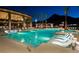 Community pool with lounge chairs and luxury amenities, set against a backdrop of majestic mountains at 2927 The Peaks Ln, Las Vegas, NV 89138