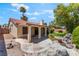 Inviting backyard featuring a covered patio, rock feature, and well-maintained lawn at 3108 Leafwood St, Las Vegas, NV 89108