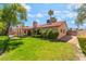Expansive backyard with lush green lawn, mature trees, and privacy landscaping at 3108 Leafwood St, Las Vegas, NV 89108